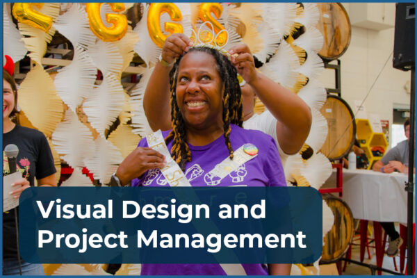 A smiling Black woman being crowned with an egg tiara and wearing a sash that says "Best Egg in Show"