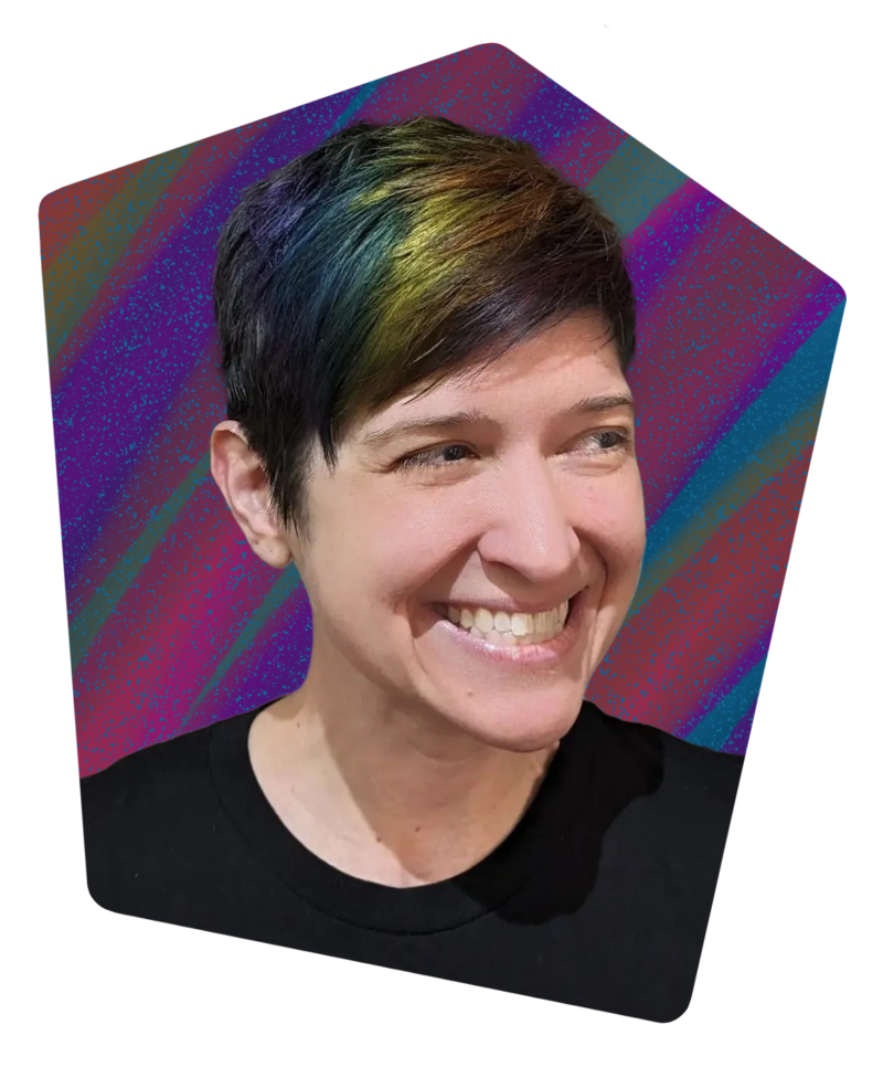 Photo of smiling woman with rainbow-colored hair, on a colorful background.